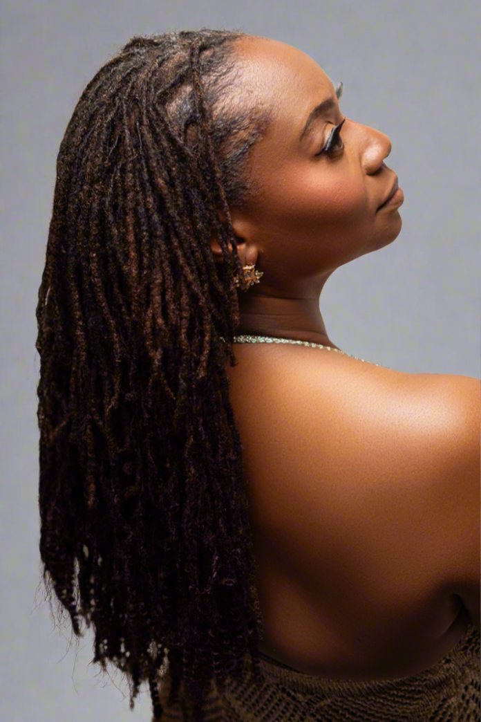 Loc-Ins model facing the right showing her loc clip-in extensions with her back to the camera.