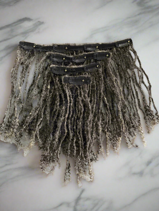 Loc clip-in extensions with curly ends in a grayscale color.